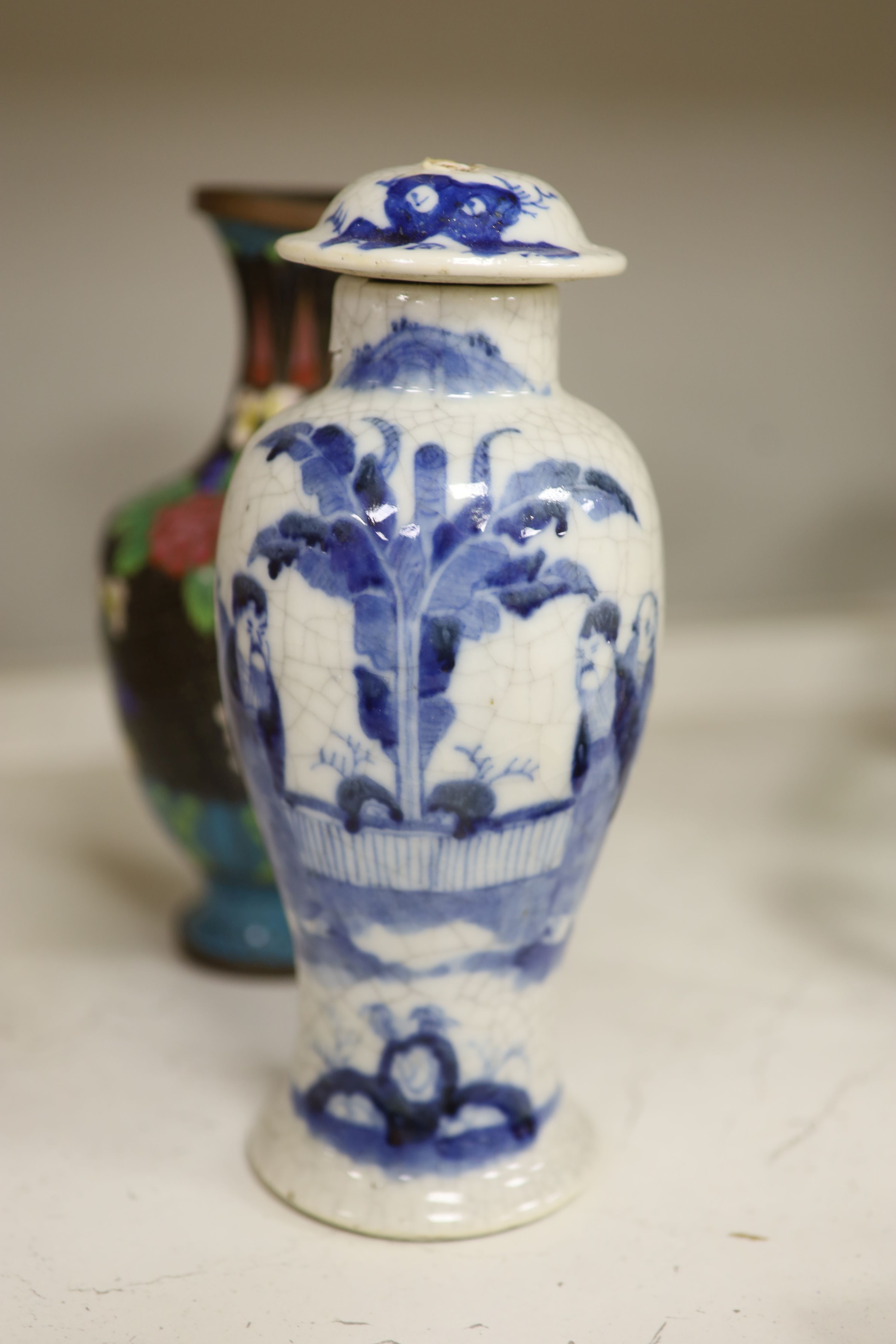 Three Chinese blue and white vases, a cloisonne enamel vase, another vase and a soapstone figure